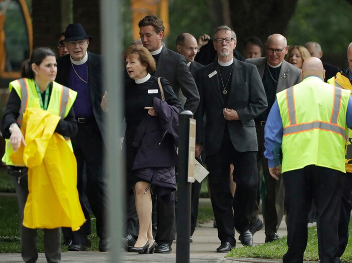 Attendees arrive at St. Martin's Episcopal Church for a funeral service for former first lady Barbara Bush, Saturday, April 21, 2018, in Houston. (AP Photo/Evan Vucci)