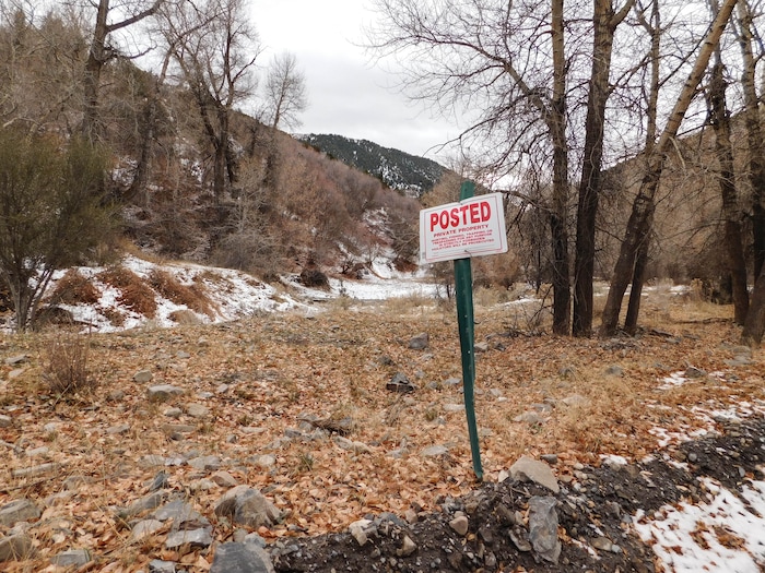 (Erin Alberty | The Salt Lake Tribune) Signs mark public and private property in Ophir Canyon. Photo taken Nov. 20, 2017.