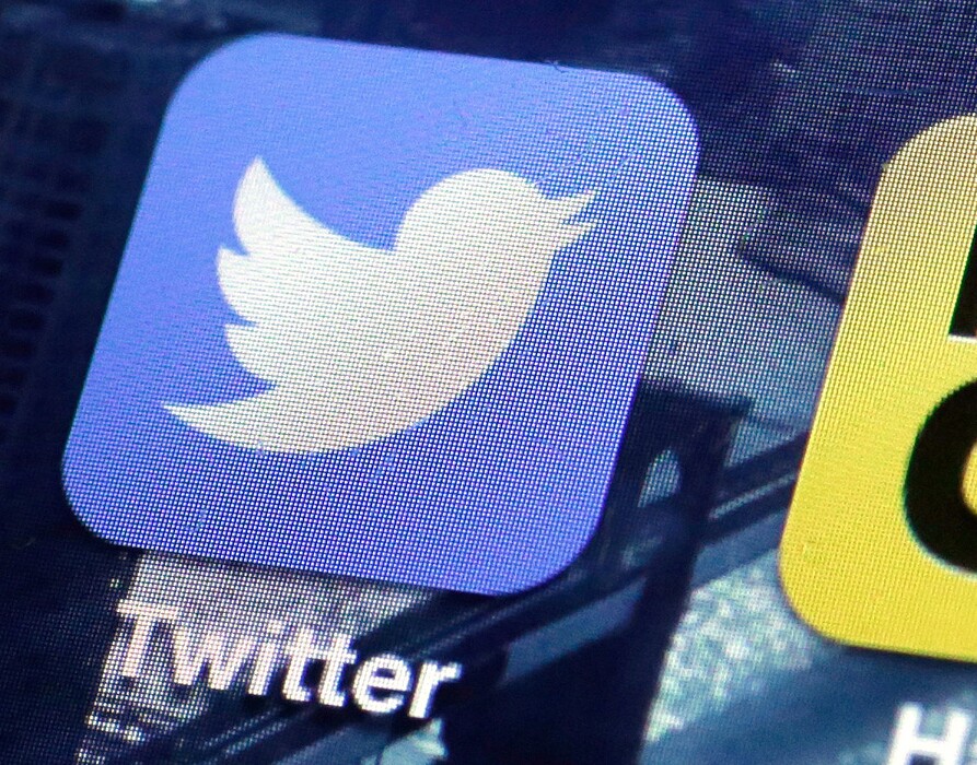 This Friday, Oct. 18, 2013, file photo, shows a Twitter app on an iPhone screen in New York. (AP Photo/Richard Drew, File)