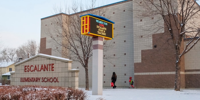 (Leah Hogsten | The Salt Lake Tribune) Students of Escalante Elementary in Salt Lake City head back to class, January, 25, 2021. Salt Lake City School District reopened all of the district's elementary schools to in-person learning on Monday. It is the first time students in kindergarten through sixth grade are back in the classroom for a full day of school since they first closed for the pandemic in March 2020.