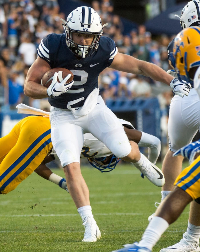(Rick Egan  |  The Salt Lake Tribune)    Brigham Young Cougars running back Matt Hadley (2) runs the ball as McNeese State Cowboys defensive back Andre Sam (21) defends, in football action Brigham Young Cougars vs McNeese State Cowboys at Lavell Edwards Stadium, Saturday, Sept. 22, 2018.


