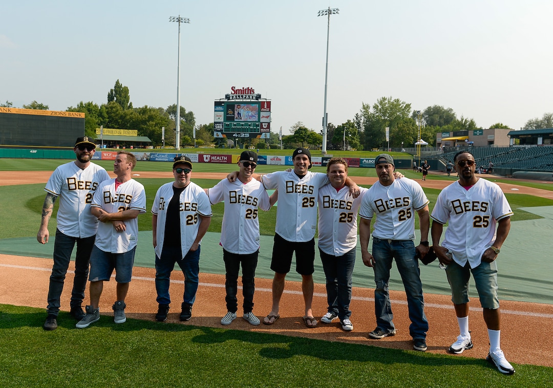 (Francisco Kjolseth  |  The Salt Lake Tribune)  The Salt Lake Bees celebrate the 25th anniversary of the Utah-filmed "The Sandlot" with members of the original cast at the Smith's Ballpark on Friday, Aug. 10, 2018. Bertram (Grant Gelt), Smalls (Tom Guiry), Tommy (Shane Obedzinski) Timmy (Victor DiMattia), Phillips (Wil Horneff) Ham (Patrick Renna), Yeah-Yeah (Marty York) and DeNunez (Brandon Quintin Adam), from left, gather on the field with their personalized Bees jerseys before the start of the night's game. 