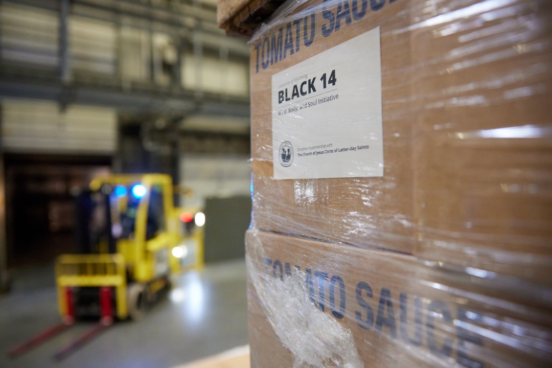 (Photo courtesy of The Church of Jesus Christ of Latter-day Saints) Boxes of tomato sauce at the Bishops Central Storehouse in Salt Lake City.  The  LDS Church partnered with the Black 14 Philanthropy to bring 180 tons of food to nine cities throughout the United States.