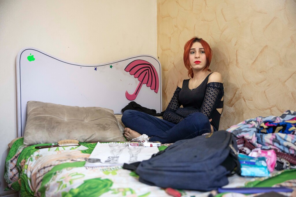 (Nariman El-Mofty | The Associated Press) In this Oct. 31, 2019, photo, Egyptian activist and transgender woman Malak el-Kashif sits in her room in Cairo, Egypt. El-Kashif's activism extends beyond advocating for the LGBTQ community. She was arrested last year after she called for protests following a fatal train crash because of what she saw as government negligence. She was imprisoned in a men's prison. The arrest, her third, sparked an outcry as activists and rights groups feared for her safety, especially due to her gender identity. She was held in solitary confinement.