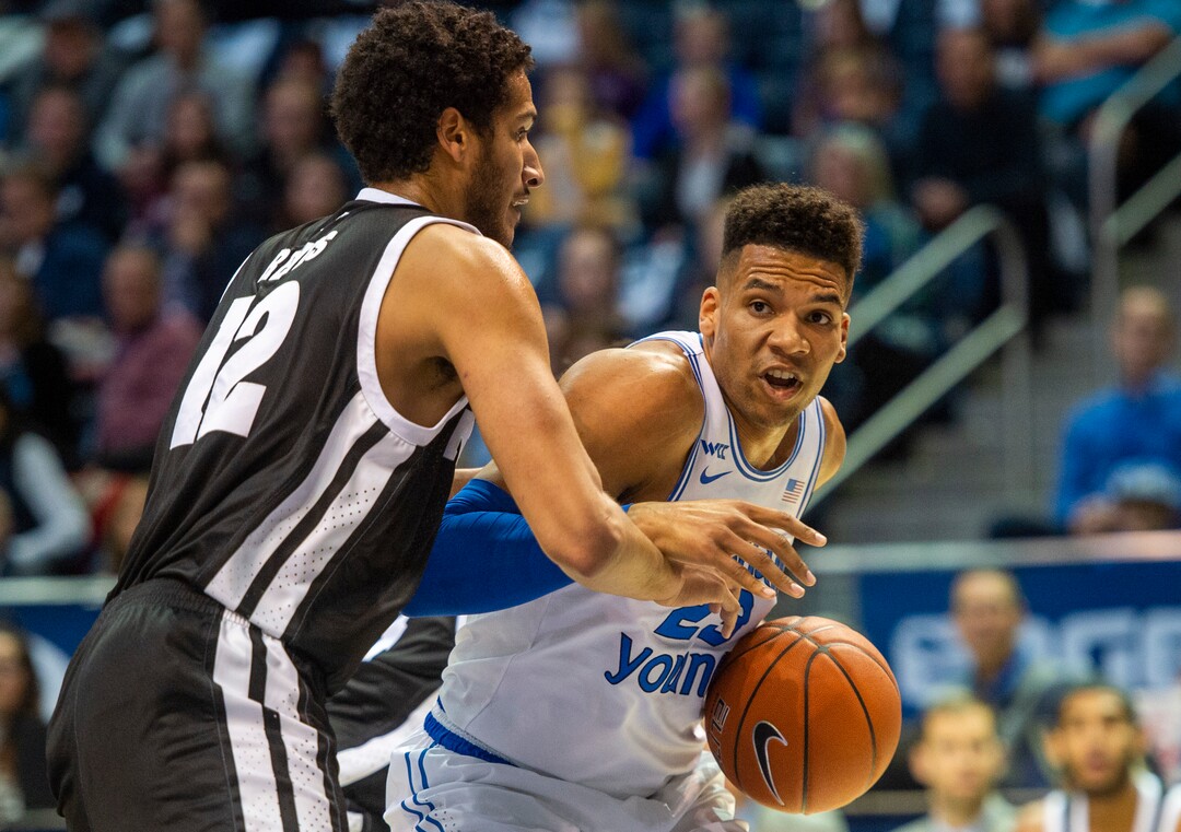 (Rick Egan  |  The Salt Lake Tribune)        Brigham Young Cougars forward Yoeli Childs (23) tries to work the ball inside, as Nevada Wolf Pack forward Johncarlos Reyes (12) defends, in basketball action between the Brigham Young Cougars and the Nevada Wolf Pack, at the Marriott Center, in Provo, Saturday, December 10, 2019.