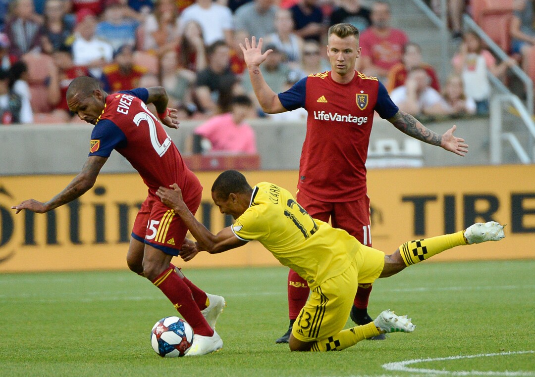 (Francisco Kjolseth  |  The Salt Lake Tribune)  Real Salt Lake midfielder Everton Luiz (25) pushes past Columbus Crew midfielder Ricardo Clark (13) as Real Salt Lake hosts Columbus Crew SC, in MLS Soccer at Rio Tinto Stadium in Sandy, Utah on Wed, July 3, 2019.
