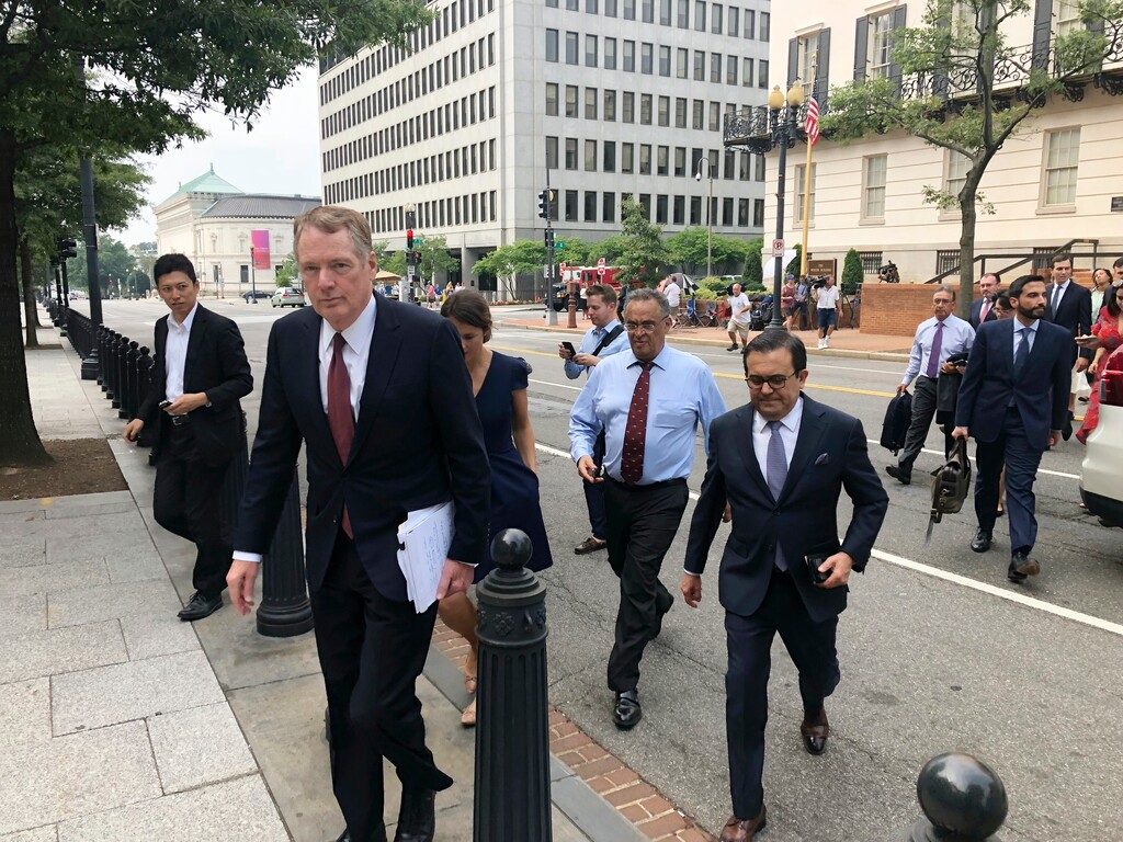 (Luis Alonso Lugo | The Associated Press) United States Trade Representative Robert Lighthizer, front left, and Mexican Secretary of Economy Idelfonso Guajardo, front right, walk to the White House on Monday August 27, 2018. President Donald Trump says the prospects are "looking good" for an agreement with Mexico that could set the stage for an overhaul of the North American Free Trade Agreement.