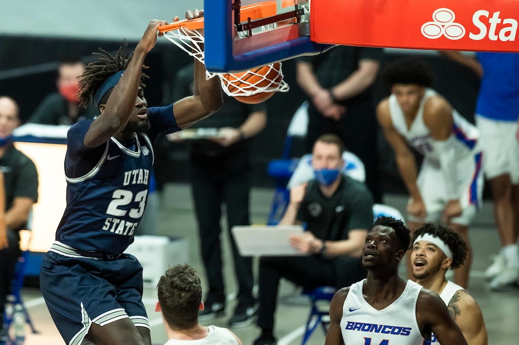 Utah State center Neemias Queta (23) dunks the ball during the first half of an NCAA college basketball game against Boise State Wednesday, Feb. 17, 2021 at ExtraMile Arena in Boise, Idaho. (Darin Oswald/Idaho Statesman via AP)