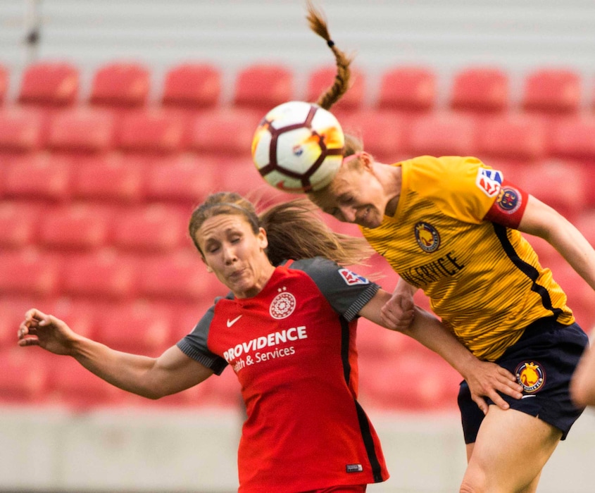(Rick Egan  |  The Salt Lake Tribune)     Portland Thorns FC forward Mallory Weber (26) and Utah Royals FC defender Becky Sauerbrunn (4) go for the ball, in soccer action between Utah Royals FC and Portland Thorns FC, at Rio Tinto Stadium, Saturday, April 28, 2018.