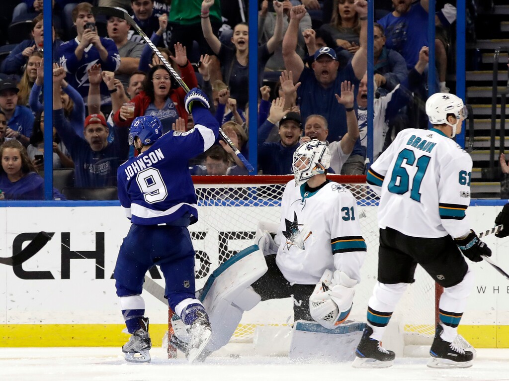 Tampa Bay Lightning center Tyler Johnson (9) celebrates after scoring past San Jose Sharks goalie Martin Jones (31) during the third period of an NHL hockey game Saturday, Dec. 2, 2017, in Tampa, Fla. (AP Photo/Chris O'Meara)