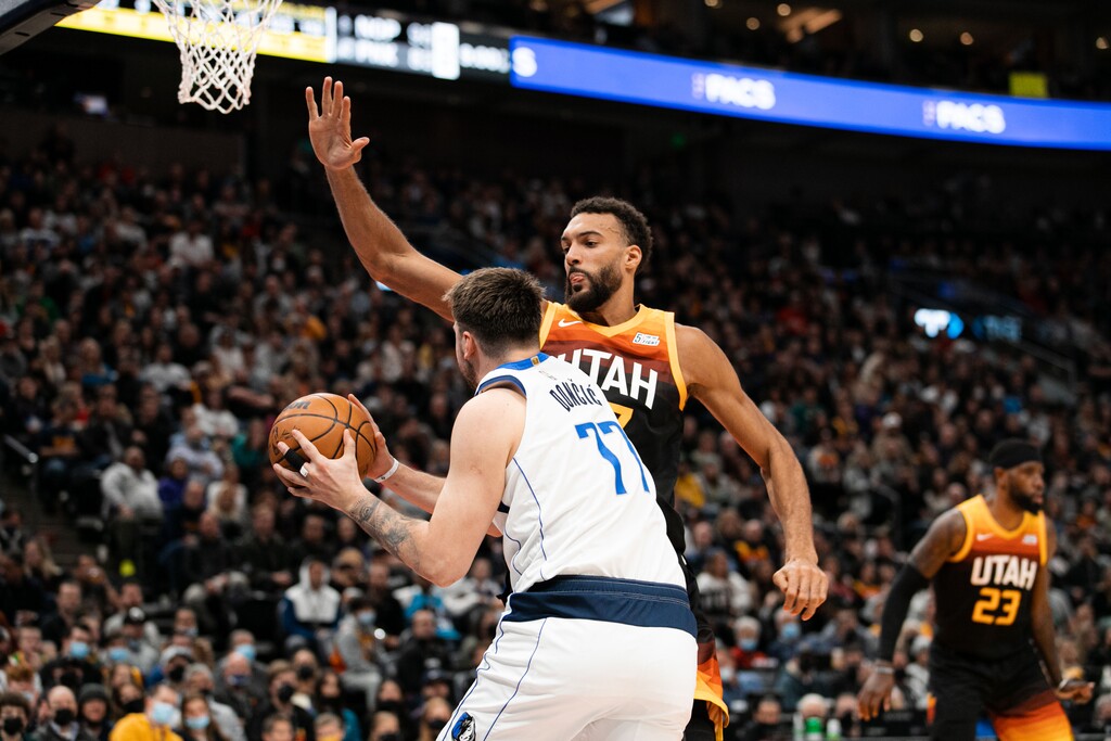 (Rachel Rydalch | The Salt Lake Tribune) Rudy Gobert, left, defends the basket for a stop against Dallas Mavericks, Luke Doncic, in the Vivint arena in Salt Lake City on Friday, Feb. 25, 2022.