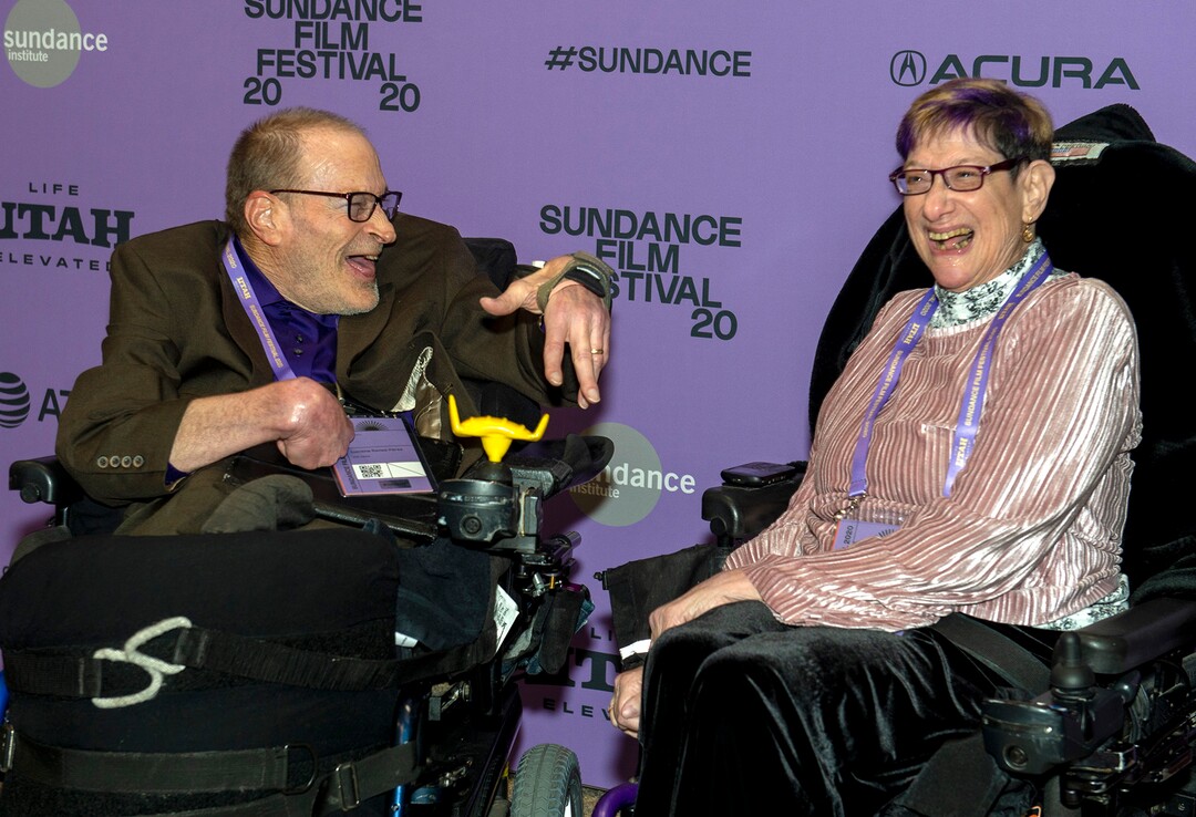 (Rick Egan  |  The Salt Lake Tribune)     Neil Jacobson shares a laugh with Denise Jacobson, on the red carpet for the film "Crip Camp", the opening night film of the 2020 Sundance Film Festival, at the Eccles Theatre in Park City, Thursday, Jan. 23, 2020.
