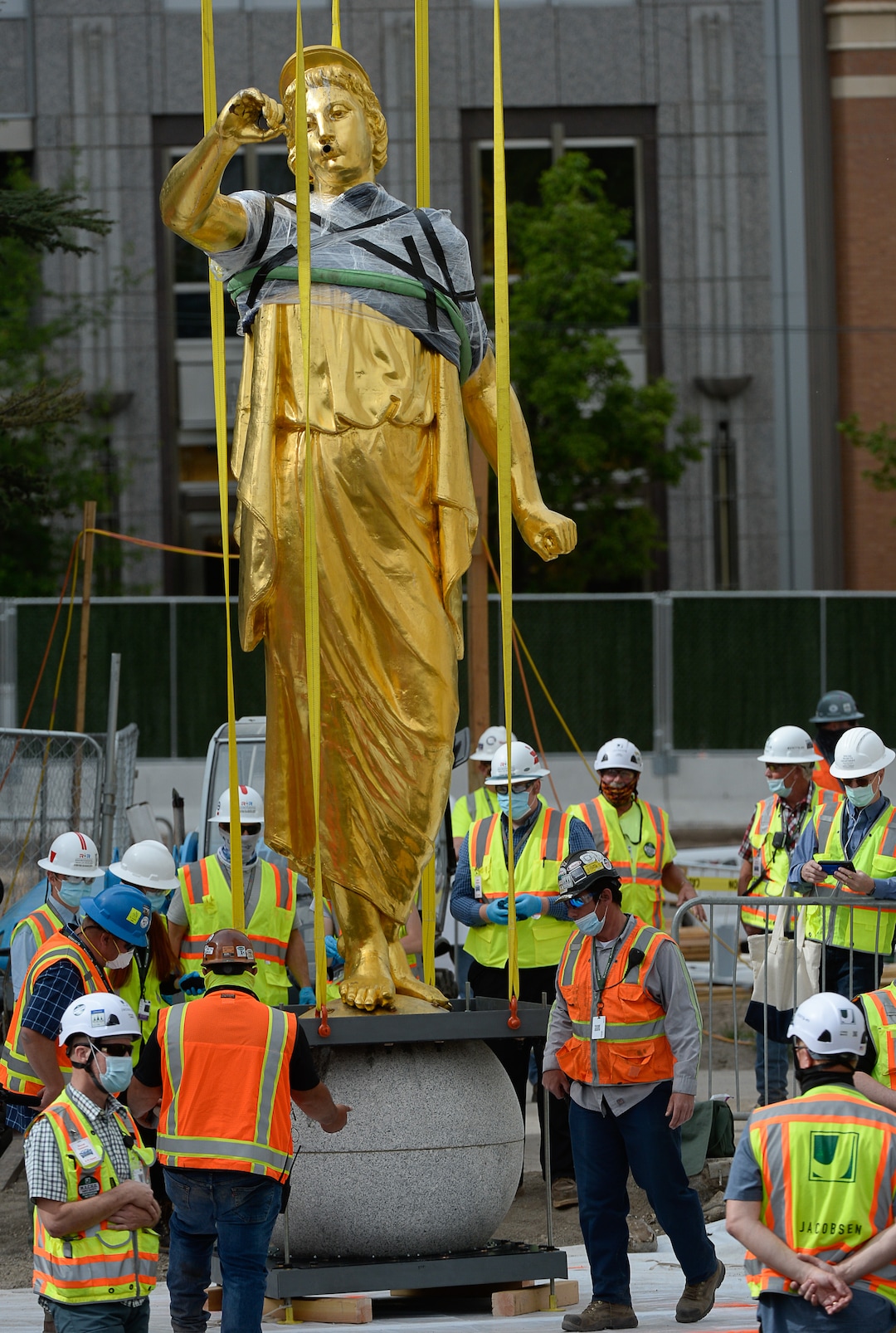 (Francisco Kjolseth  |  The Salt Lake Tribune) The Angel Moroni statue is pulled from atop the Salt Lake Temple of The Church of Jesus Christ of Latter-day Saints on Monday, May 18, 2020. The temple closed in December for seismic upgrades and sustained minor damager during the March 18, 2020, magnitude 5.7 earthquake when the trumpet held by the angel fell off and several smaller spire stones were displaced.