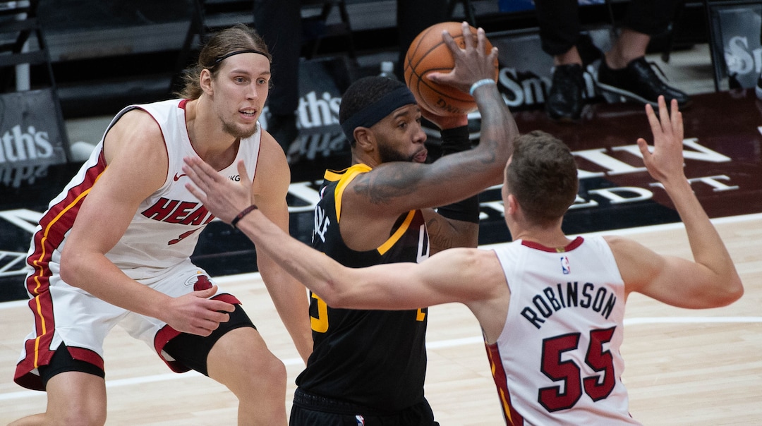 (Francisco Kjolseth  | The Salt Lake Tribune) Utah Jazz forward Royce O'Neale (23) is pressured by Miami Heat forward Kelly Olynyk (9) and Miami Heat guard Duncan Robinson (55) as the Utah Jazz take on the Miami Heat at Vivint Smart Home Arena in Salt Lake City, on Saturday, Feb. 13, 2021.