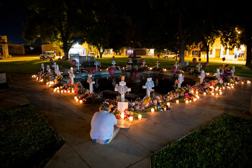 (Ivan Pierre Aguirre | The New York Times)
A woman mourns before the 21 crosses bearing the names of the victims of the mass shooting at Robb Elementary School at a memorial set up in the town square in Uvalde, Texas, May 27, 2022. On this week's "Mormon Land" podcast, two religion scholars discuss whether leaders of The Church of Jesus Christ of Latter-day Saints will or should weigh in on the issue of guns and gun violence.
