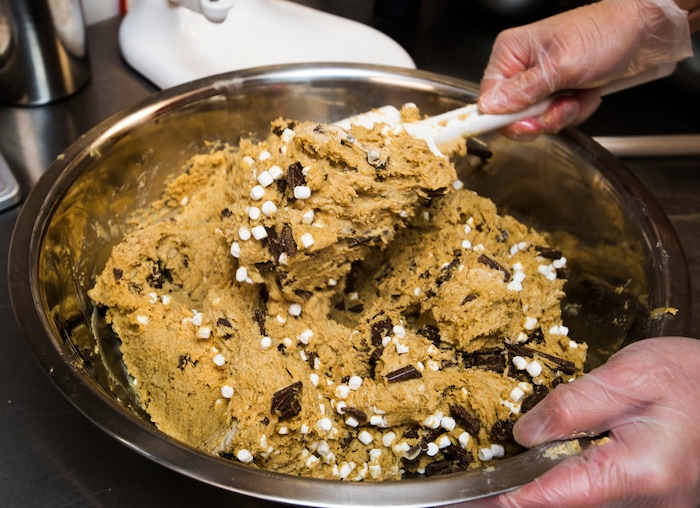 Rick Egan  |  The Salt Lake Tribune
Sarah McNamara, owner of Dough Co., mixes a batch of s'more cookie dough. The new dessert shop in Sugar House sells scoops of edible cookie dough. Monday, July 31, 2017