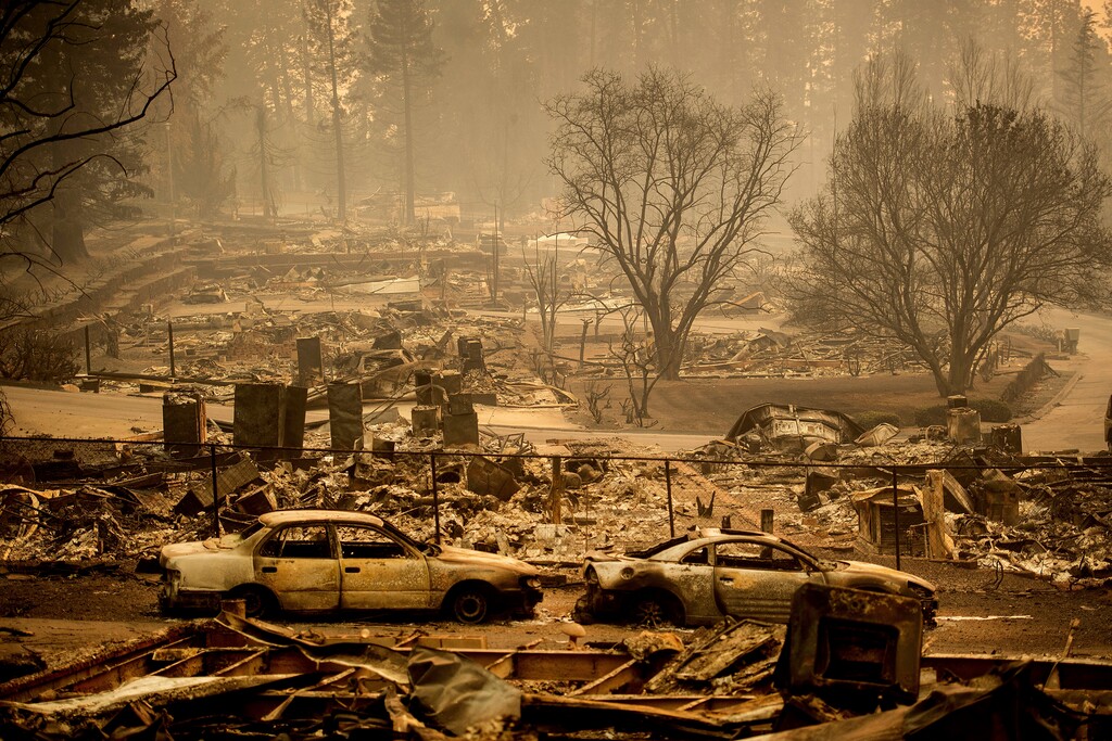 Noah Berger | AP file photo
Homes leveled by the Camp Fire line a development on Edgewood Lane in Paradise, Calif. Pacific Gas and Electric says it has reached a $13.5 billion settlement that will resolve all major claims related to devastating wildfires blamed on its outdated equipment and negligence. The settlement, which the utility says was reached Friday, Dec. 6, 2019, still requires court approval.