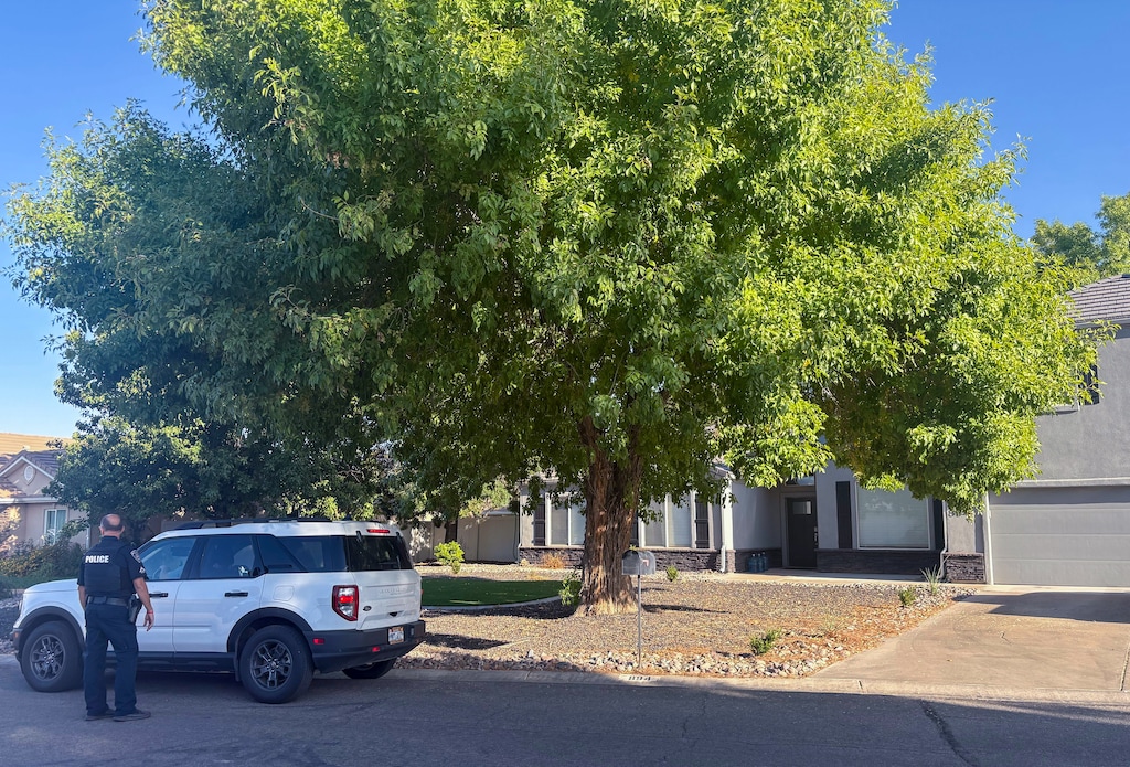 (Brooke Larsen | The Salt Lake Tribune) Police are stationed outside a house where Tyler Robinson reportedly lived in Washington City, Friday, Sept. 12, 2025. Robinson was arrested late Thursday as a suspect in the shooting death of Charlie Kirk.