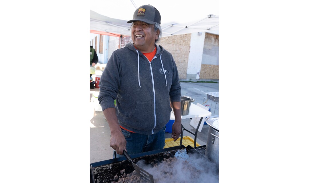 (Rick Egan | The Salt Lake Tribune) Dave John cooks up some meat for Navajo Tacos, as he teams up with Black Lives for Humanity and other volunteers to serve a "Gratitude Dinner" to more than 100 people from the unsheltered population, on 500 West in Salt Lake City, onThursday, Nov. 25, 2021.