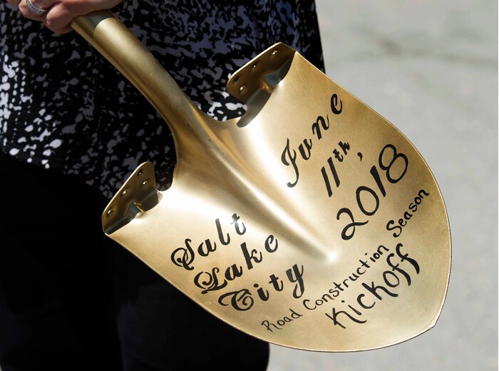 (Rick Egan | The Salt Lake Tribune) Salt Lake City Mayor Jackie Biskupski holds a golden shovel, as she talks to the news media, after announcing the start of the city’s 2018 road construction season at a new conference at 720 South Gladiola Street. A total of ten projects are scheduled for completion by the City’s Engineering Division through a combined investment of $5 million. Monday, June 11, 2018.