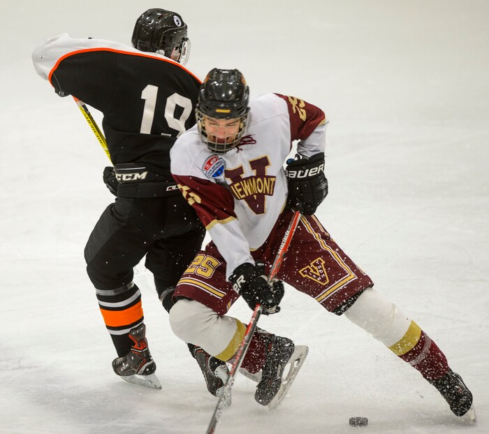 (Steve Griffin  |  The Salt Lake Tribune) Viewmont's  Zac Boam, right, crashes into Murray's Stewart McKenna during the Division 1 ice hockey state title game at the Salt Lake City Sports Complex in Salt Lake City Tuesday Feb. 20, 2018.Stewrat McKenna