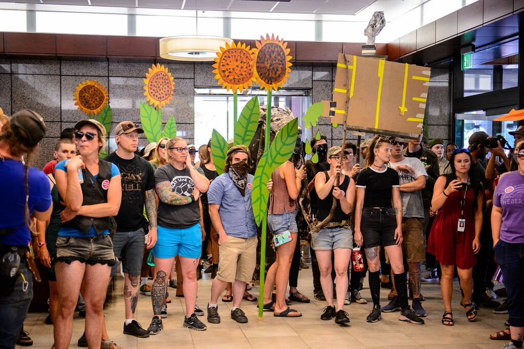 (Trent Nelson | The Salt Lake Tribune) Anti-inland port protesters occupy the lobby of the Chamber of Commerce Building in Salt Lake City on Tuesday, July 9, 2019.