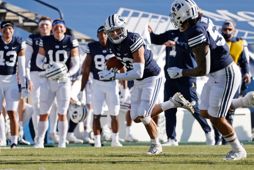 (Jeff Swinger | The Associated Press/Pool) BYU linebacker Isaiah Kaufusi (53) runs with a fumble recovery against North Alabama in the second quarter during an NCAA college football game Saturday, Nov. 21, 2020, in Provo, Utah.