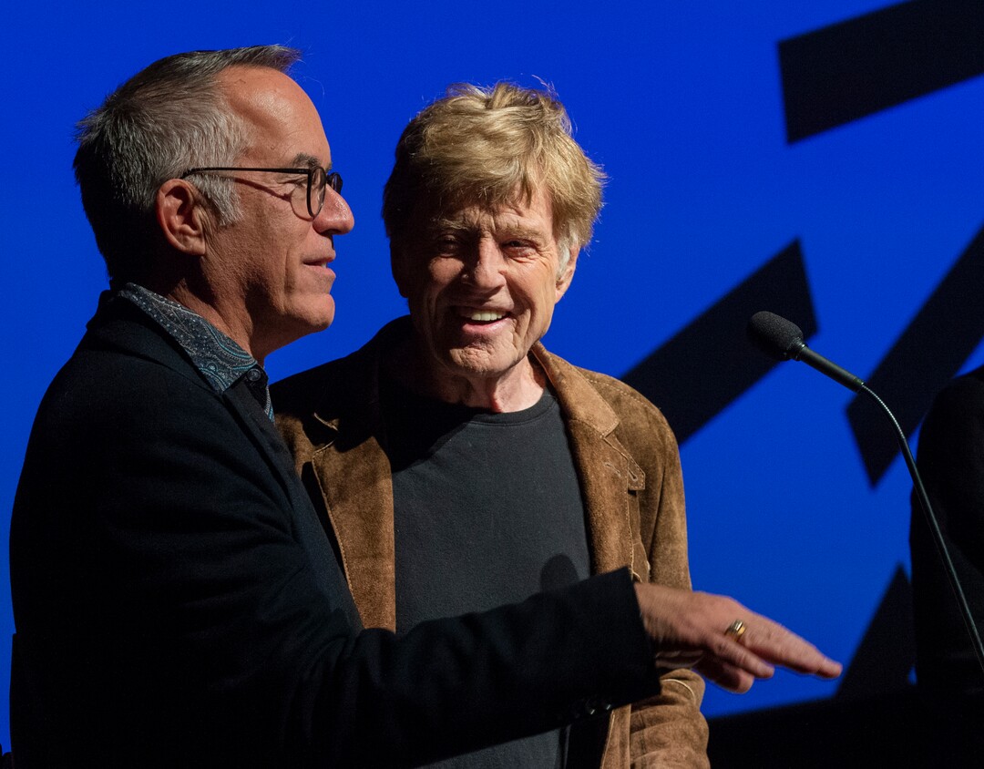 (Rick Egan  |  The Salt Lake Tribune)     Sundance Film Festival director John Cooper and Founder Robert Redford, welcome the crowd to Opening night film of the 2020 Sundance Film Festival, "Crip Camp", at the Eccles Theatre in Park City, Thursday, Jan. 23, 2020.
