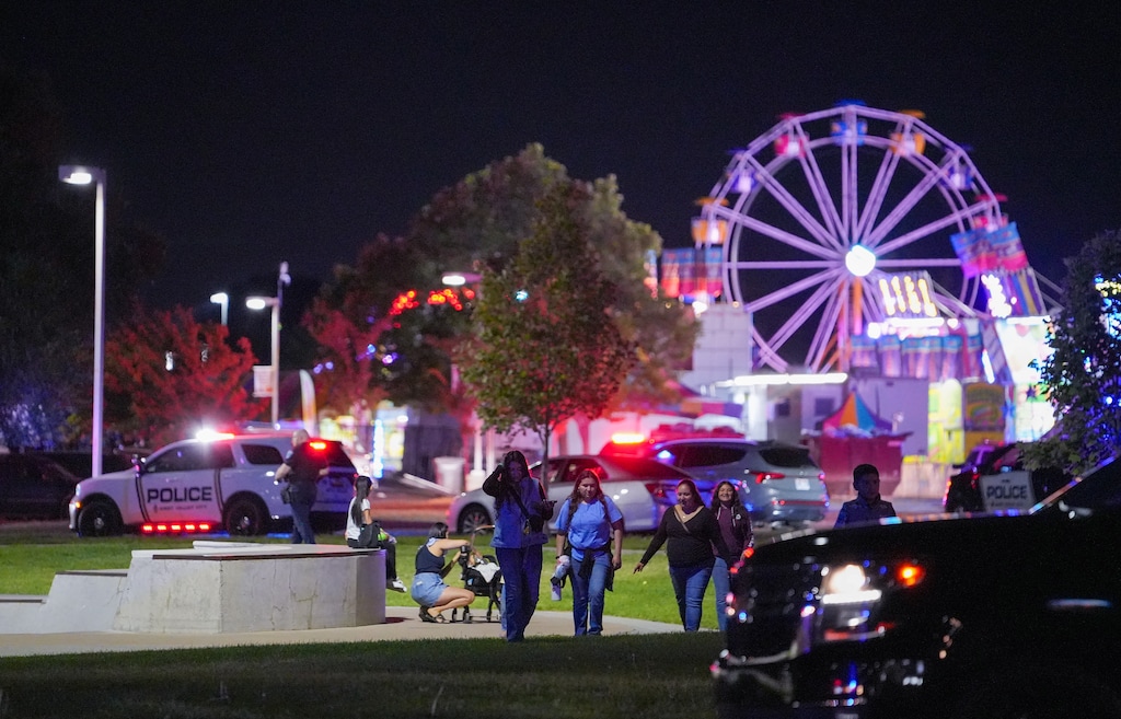 (Chris Samuels | The Salt Lake Tribune) People leave Centennial Park as law enforcement investigate after a reported shooting at WestFest in West Valley City, Sunday, June 15, 2025.