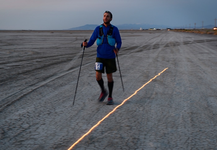 (Scott Sommerdorf | The Salt Lake Tribune)
Alex Doolan makes his way to Aid Station 14 - the last checkpoint before the finish line at the Salt Flats 100 Endurance Run, Saturday, May 5, 2018.

