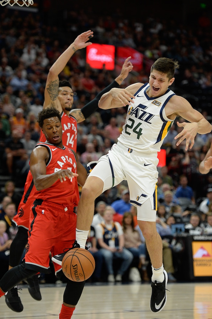 (Francisco Kjolseth  |  The Salt Lake Tribune)  Utah Jazz guard Grayson Allen (24) battles Toronto Raptors guard Kyle Lowry (7) in the first half of the preseason NBA game at Vivint Smart Home Arena Tuesday, Oct. 2, 2018, in Salt Lake City.