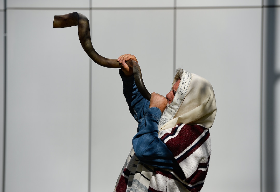 (Francisco Kjolseth  |  The Salt Lake Tribune)  Brad Thornton of Las Vegas, Nev., blows a Jewish shofar horn as he joins supporters of convicted fraudster Rick Koerber, gathered ahead of his court sentencing in Salt Lake City at the Federal Courthouse on Tuesday, Oct. 15, 2019, ending a nearly two decade white collar crime saga.