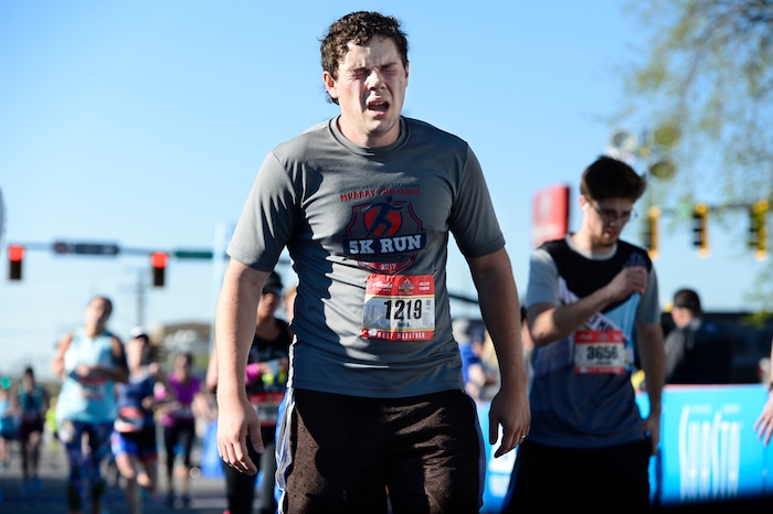 (Scott Sommerdorf | The Salt Lake Tribune)An exhausted runner crosses the finish line in the Salt Lake City half marathon, Saturday, April 21, 2018.