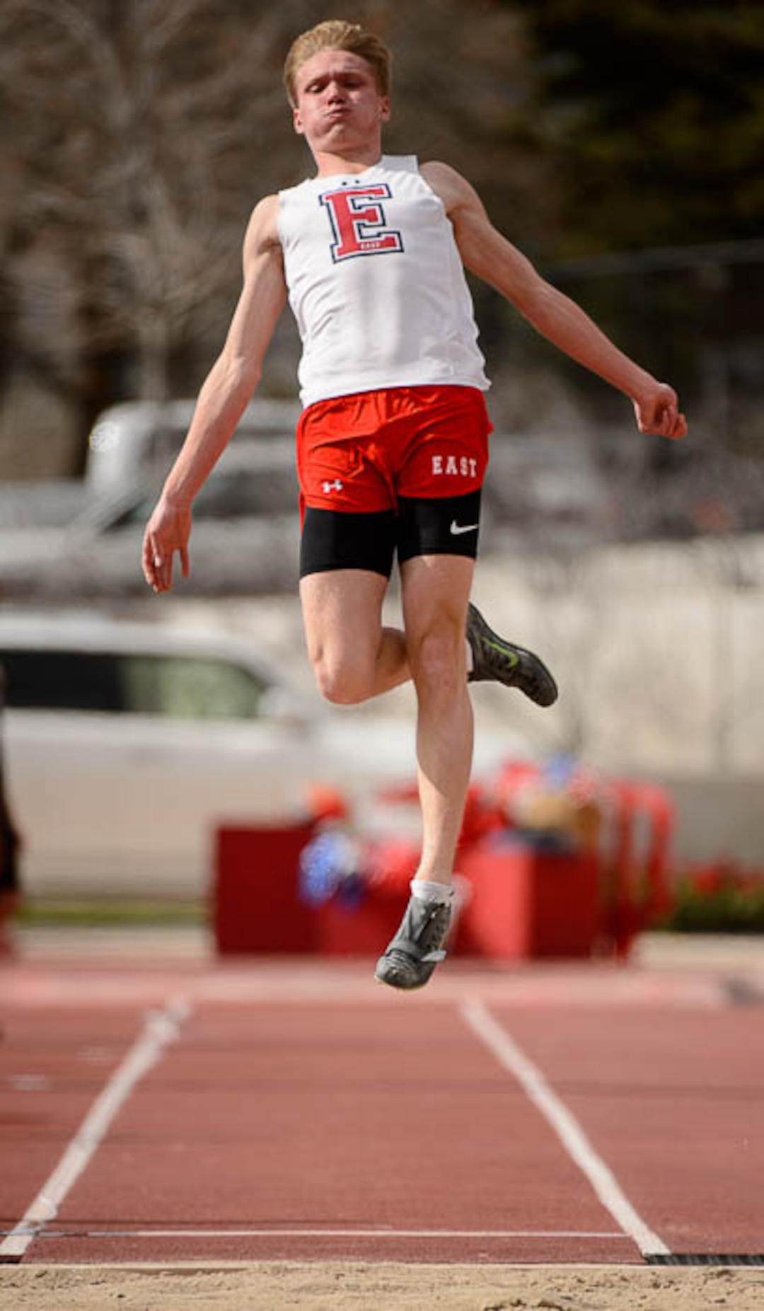 (Trent Nelson | The Salt Lake Tribune)  East track star Will Prettyman, one of the state's best long jumpers and sprinters, competing in the long jump, Thursday April 5, 2018.