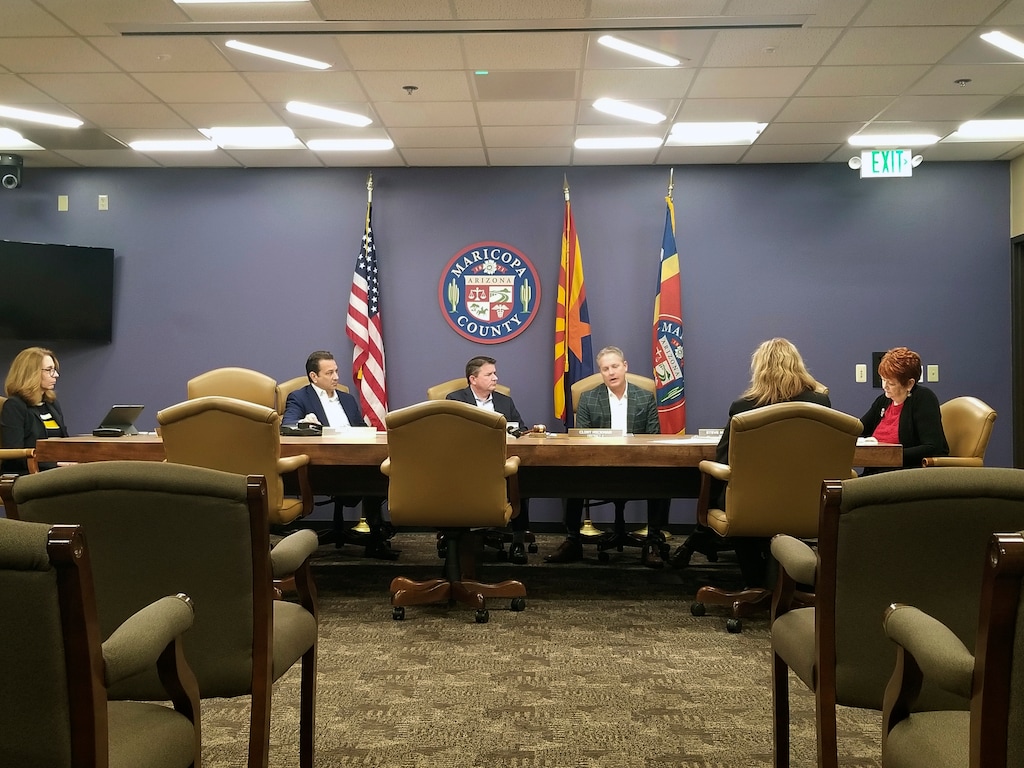 (Terry Tang | AP) The Maricopa County Board of Supervisors meets in Phoenix on Friday, Dec. 27, 2019. The board on Friday unanimously voted to uphold the suspension of County Assessor Paul Petersen and push for his removal from office. Petersen has pleaded not guilty in Arizona, Arkansas and Utah to charges involving the adoption of babies from the Marshall Islands through his law firm.