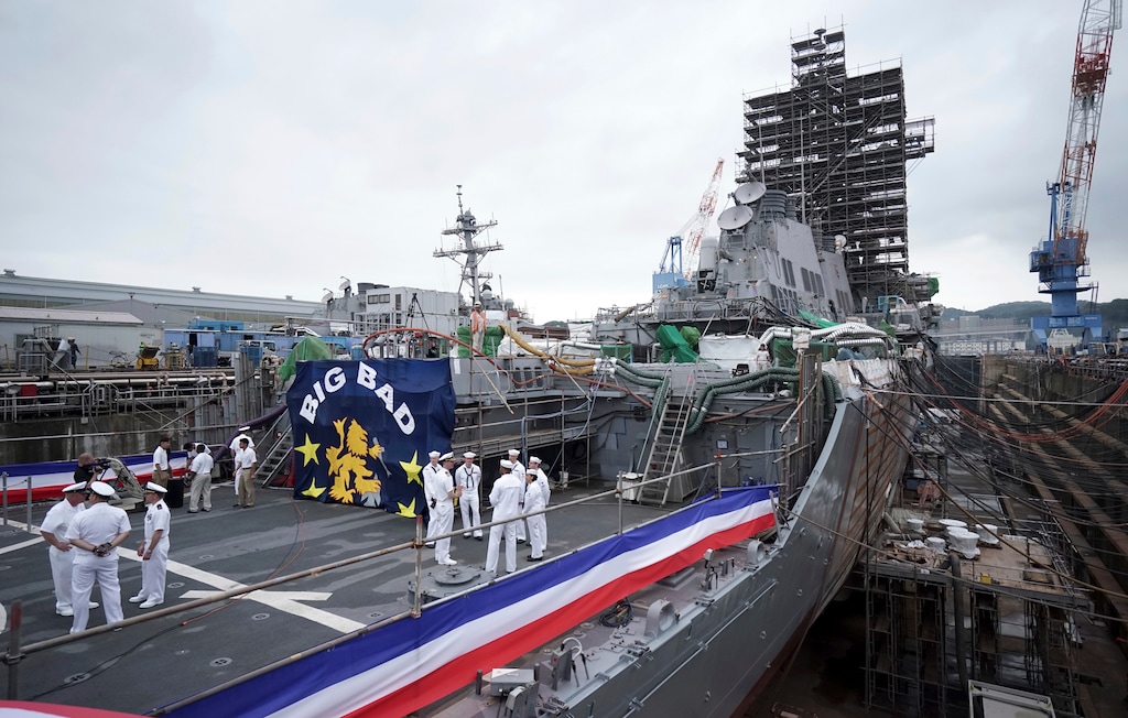 (Eugene Hoshiko | AP Photo) The USS John S. McCain under repair at a dry dock is seen after a rededication ceremony for at the U.S. Naval base in Yokosuka, southwest of Tokyo, Thursday, July 12, 2018. Navy Secretary Richard Spencer dedicated one of two destroyers involved in fatal accidents in the Pacific last year to Sen. John McCain. He added McCain's name to a Japan-based warship that was already named for the Arizona senator's father and grandfather.