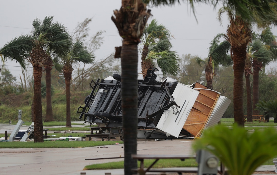 (Eric Gay | The Associated Press) An overturned trailer sits in a park in the wake of Hurricane Harvey, Saturday, Aug. 26, 2017, in Aransas Pass, Texas.   Harvey rolled over the Texas Gulf Coast on Saturday, smashing homes and businesses and lashing the shore with wind and rain so intense that drivers were forced off the road because they could not see in front of them.