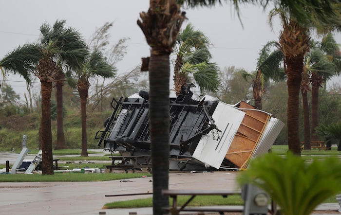 (Eric Gay | The Associated Press) An overturned trailer sits in a park in the wake of Hurricane Harvey, Saturday, Aug. 26, 2017, in Aransas Pass, Texas.   Harvey rolled over the Texas Gulf Coast on Saturday, smashing homes and businesses and lashing the shore with wind and rain so intense that drivers were forced off the road because they could not see in front of them.