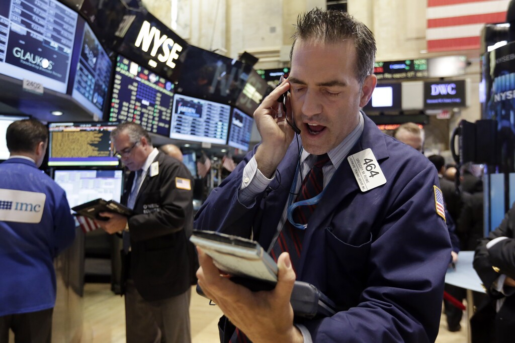 Trader Gregory Rowe works on the floor of the New York Stock Exchange, Monday, June 29, 2015. Stocks are falling in early trading in the U.S., but not as much as in Europe as Greece's debt woes deepen. (AP Photo/Richard Drew)