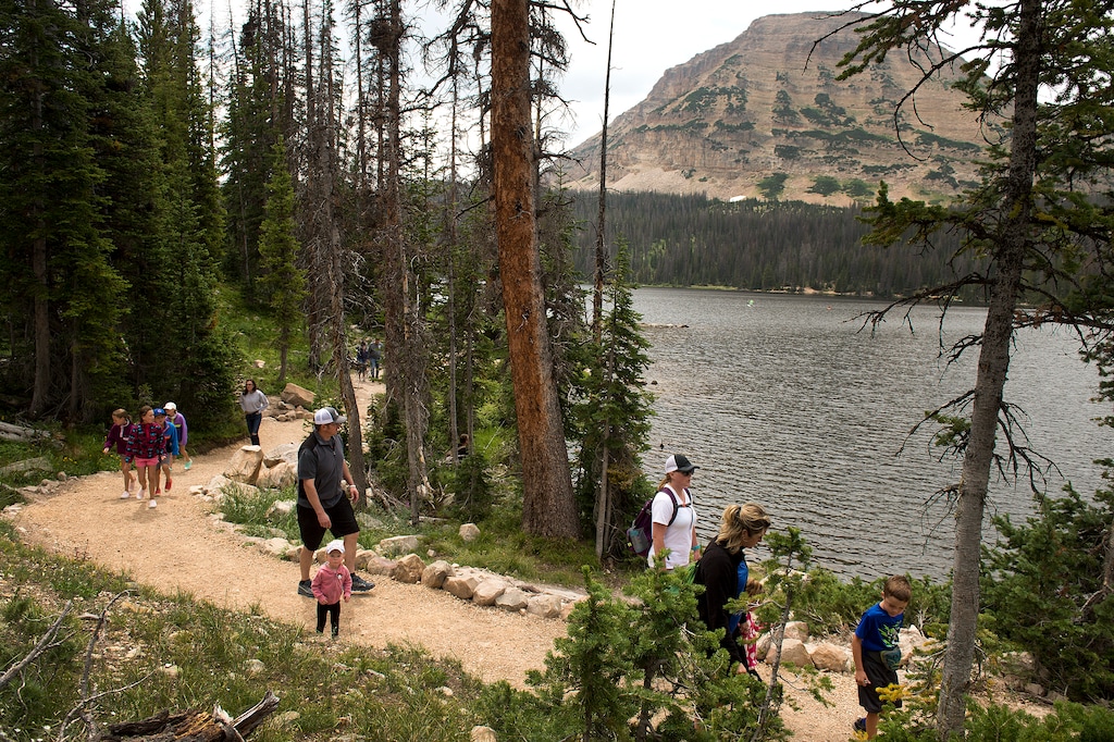 (Leah Hogsten | The Salt Lake Tribune) Visitors to Mirror Lake in the western Uintas walk the path around the lake, August 6, 2017. This fire prone region of the Uinta-Wasatch-Cache National Forest will be among those targeted for treatments to reduce fire risk under a program announced Thursday by the U.S. Forest Service.