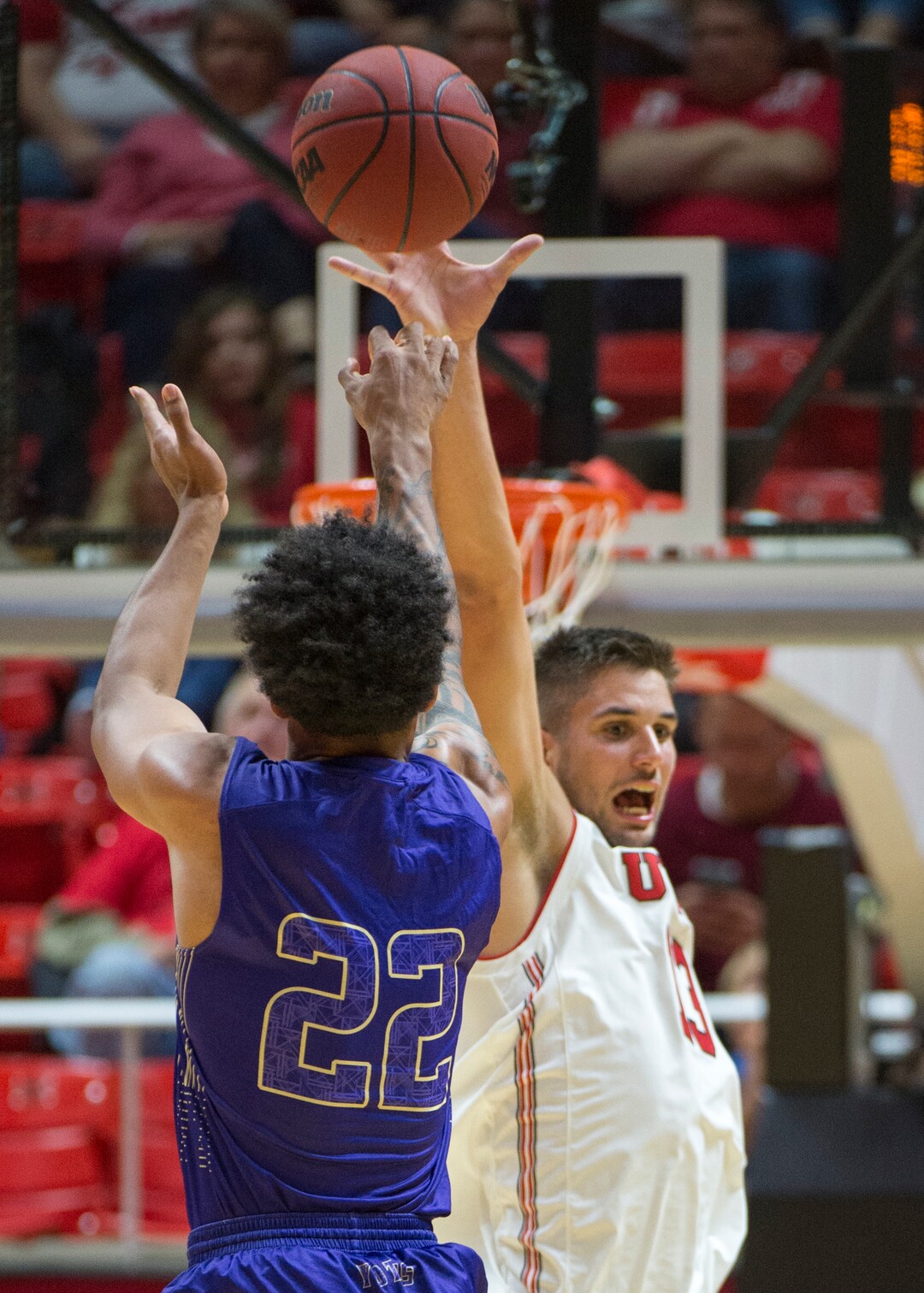 (Rick Egan  |  The Salt Lake Tribune)     Keun Palu-Thompson (22) College of Idaho, shoots, as Utah Utes forward Novak Topalovic (13) defends, in basketball action, between the Utah Utes and the College of Idaho Yotes at the Jon M. Huntsman Center, Thursday, Nov. 1, 2018.