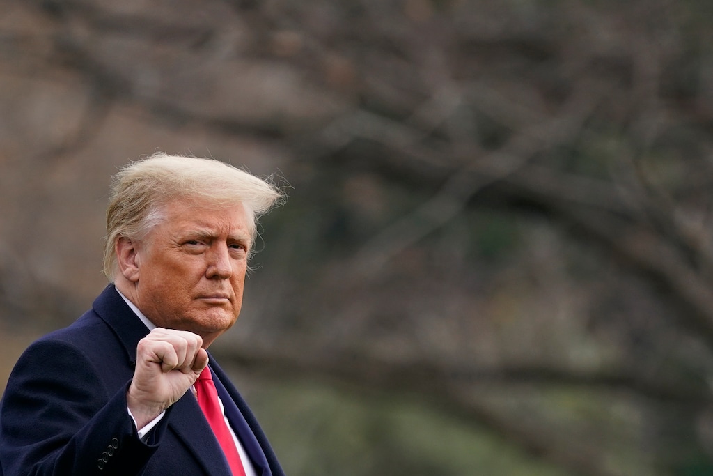 (Patrick Semansky | AP file photo)  President Donald Trump gestures as he walks on the South Lawn of the White House in Washington, Saturday, Dec. 12, 2020, before boarding Marine One.