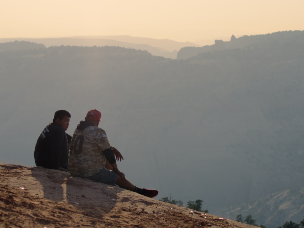 (Sorø Films) Noah Begay (left) and his father have a discussion outside of Navajo Mountain in the new documentary film "Scenes from the Glittering World."