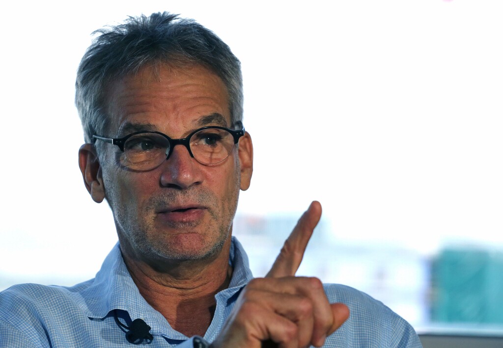 FILE - In this Sept. 17, 2014 file photo, Colorado-based author Jon Krakauer gestures during an interview in Denver. Krakauer has filed suit over a musical adaptation of his 1996 book "Into the Wild." The Boulder Daily Camera reported Friday, Dec. 7, 2018. Krakauer originally agreed to let playwrights Nikos Tsakalakos and Janet Allard use his name and the book title but changed his mind because he objected to their script. (AP Photo/Brennan Linsley, File)