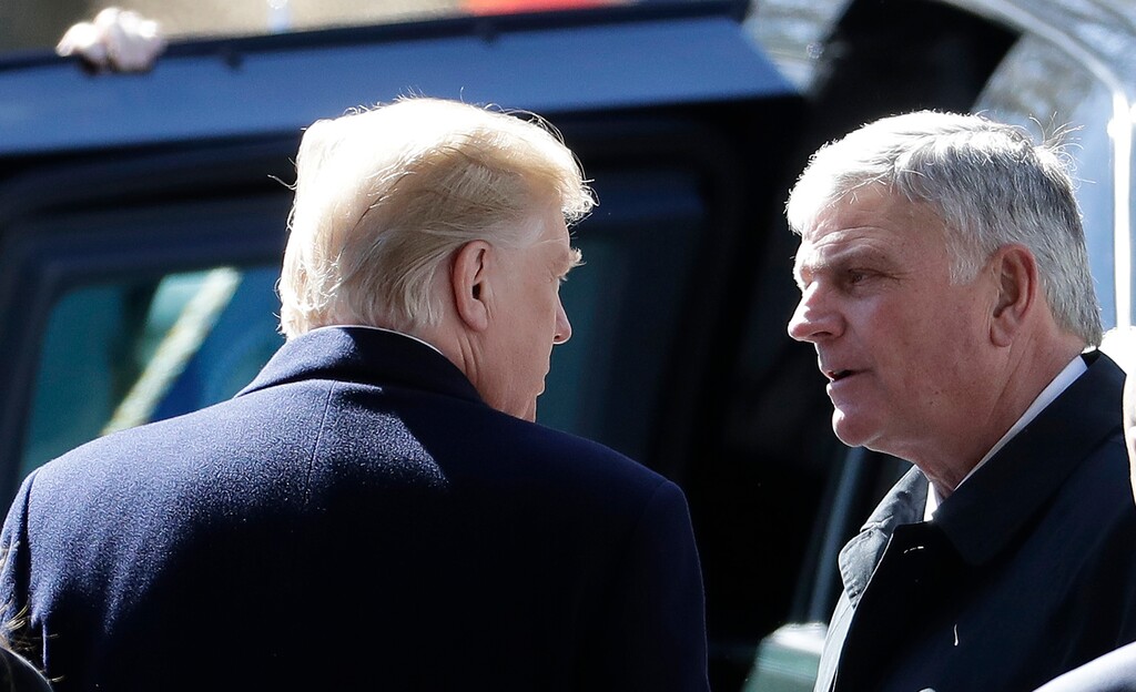 (Chuck Burton | Associated Press file photo)  President Donald Trump speaks with Pastor Franklin Graham after a funeral service at the Billy Graham Library for the Rev. Billy Graham on Friday, March 2, 2018, in Charlotte, N.C.