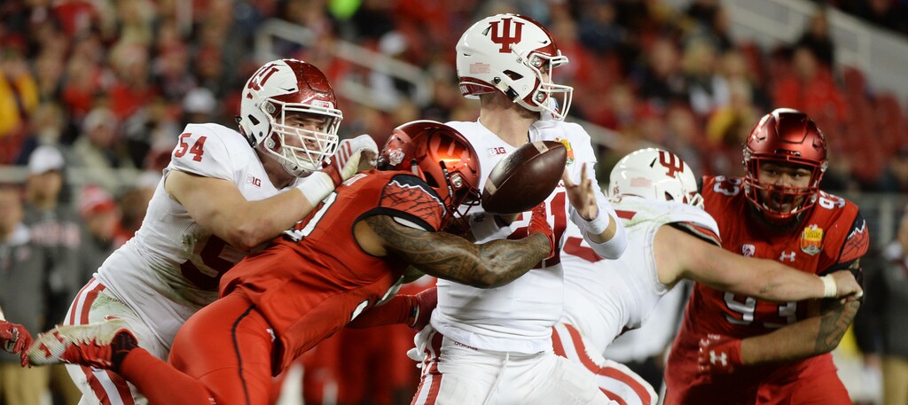 Steve Griffin / The Salt Lake Tribune
Utah Utes defensive end Pita Taumoepenu (50) strips the ball from Indiana Hoosiers quarterback Richard Lagow (21) during the Foster Farms Bowl at Levi's Stadium in Santa Clara California Wednesday December 28, 2016. The ball was recovered by Utah Utes defensive end Hunter Dimick (49) on the play.