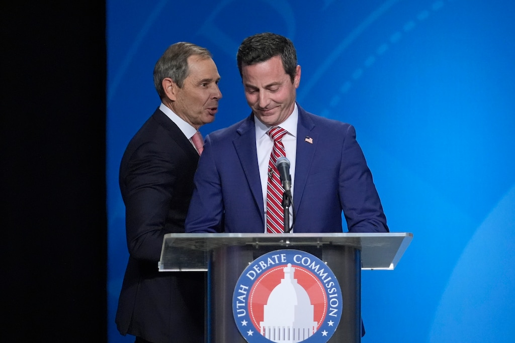 (Rick Bowmer | AP) U.S. Rep. John Curtis, left, reacts to a statement made by Trent Staggs, right, following the Utah Senate primary debate for Republican contenders battling to win the seat of retiring U.S. Sen. Mitt Romney Monday, June 10, 2024, in Salt Lake City.