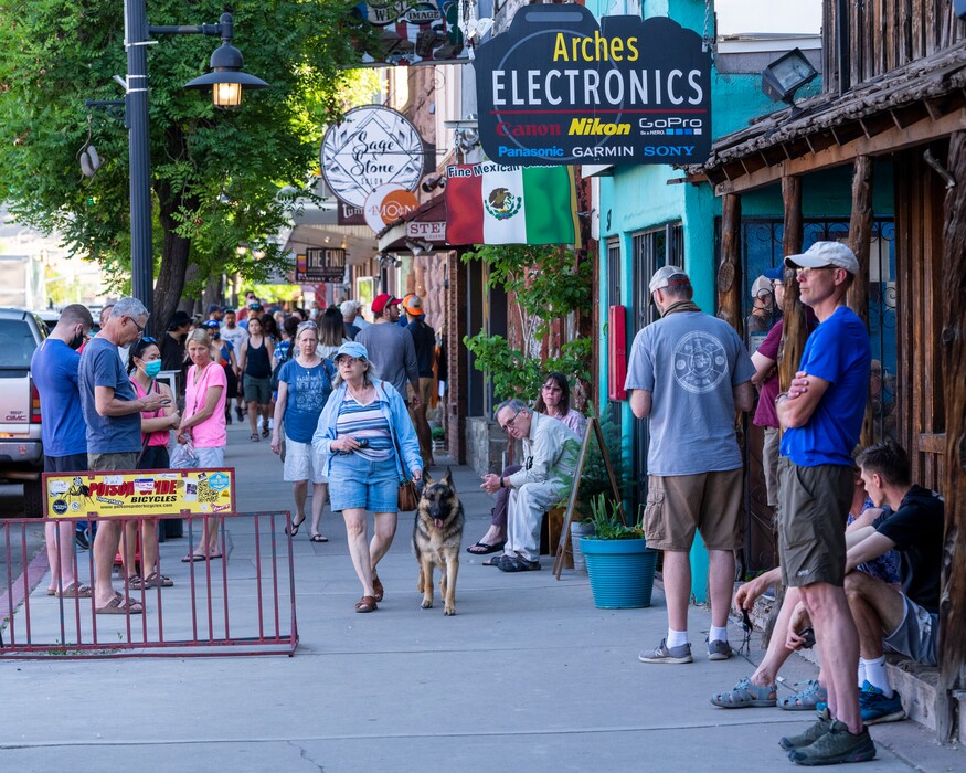 (Rick Egan | The Salt Lake Tribune) Tourists on Main Street in Moab, on Friday, May 14, 2021. Coronavirus case rates in Grand County are among the worst in the nation, following a rise in tourism events, health officials say.
