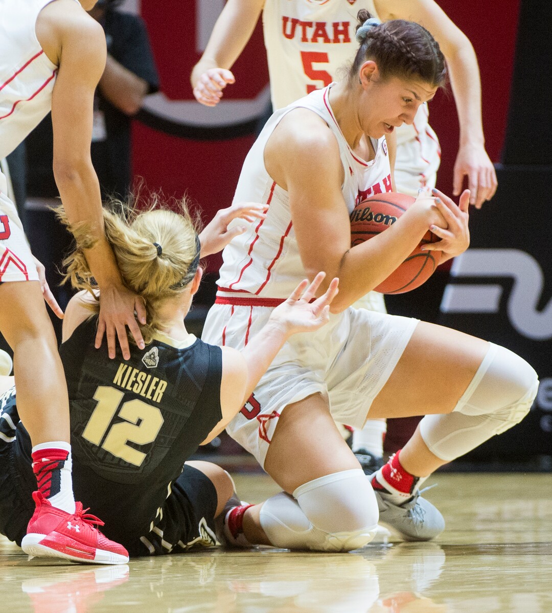 (Rick Egan  |  The Salt Lake Tribune)  Utah Utes forward Emily Potter (12) goes for the ball along with Purdue Boilermakers center Nora Kiesler (12), in basketball action Utah Utes vs. Purdue Boilermakers, at the Jon M. Huntsman Center, Monday, Nov. 20, 2017.