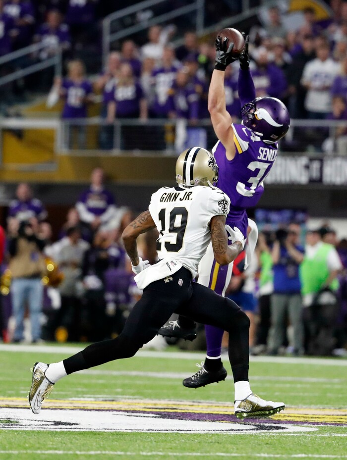 Minnesota Vikings strong safety Andrew Sendejo (34) intercepts a pass intended for New Orleans Saints wide receiver Ted Ginn (19) during the first half of an NFL divisional football playoff game in Minneapolis, Sunday, Jan. 14, 2018. (AP Photo/Jeff Roberson)